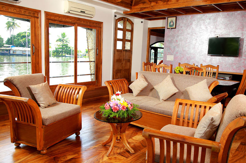 Comfortable bedroom interior inside an Alappuzha houseboat