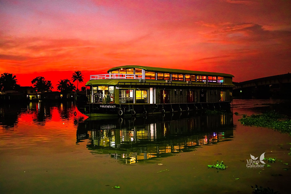 Couple watching sunset from Alleppey houseboat