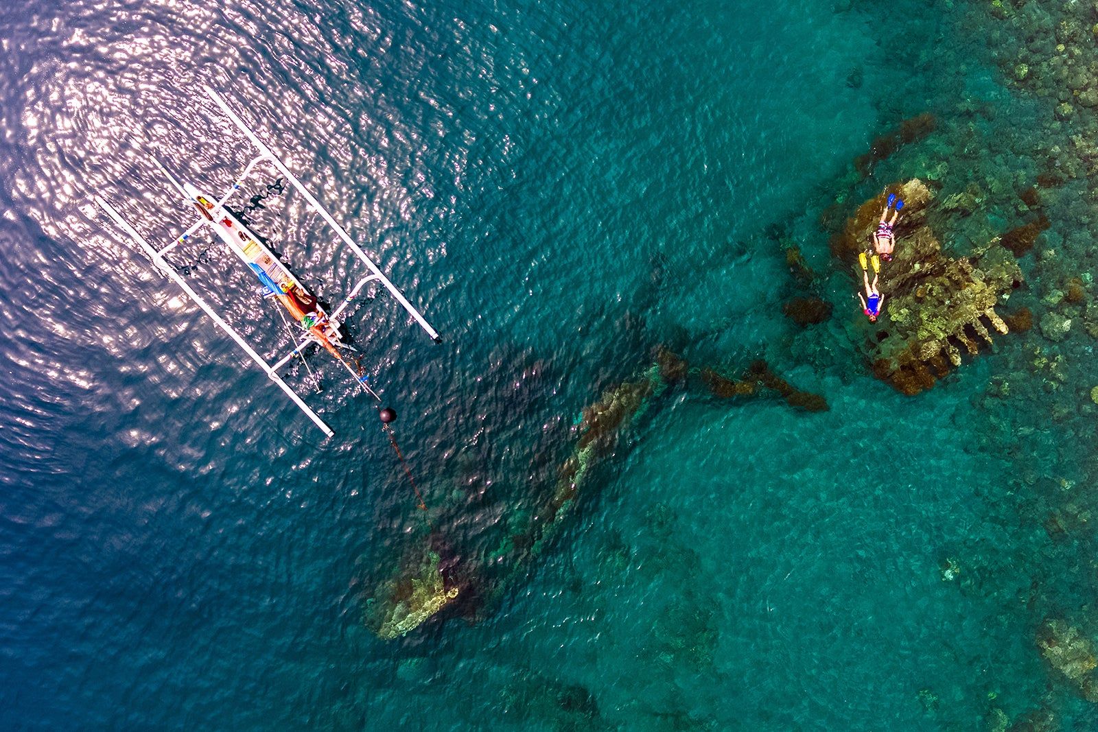Divers exploring Japanese Shipwreck in Amed Bali