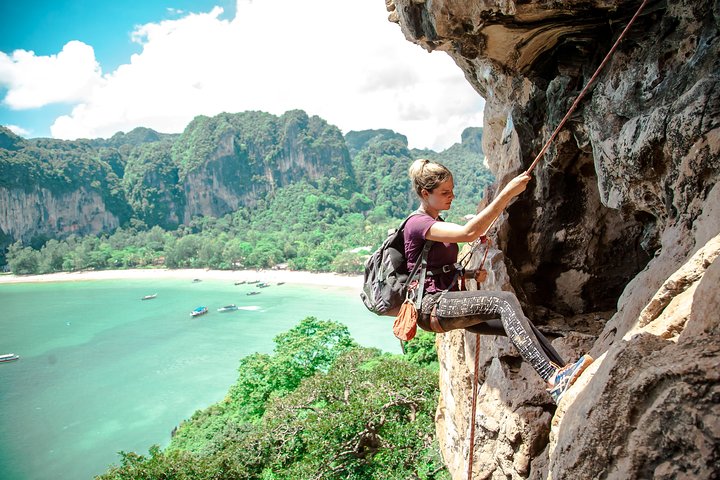 Rock climbing on limestone cliffs near Ao Nang