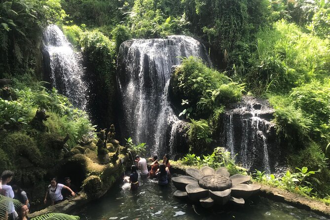 Main cascade and stone formations at Beji Griya Waterfall