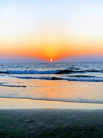 Sunset light at Benaulm Beach Goa with peaceful shoreline scene