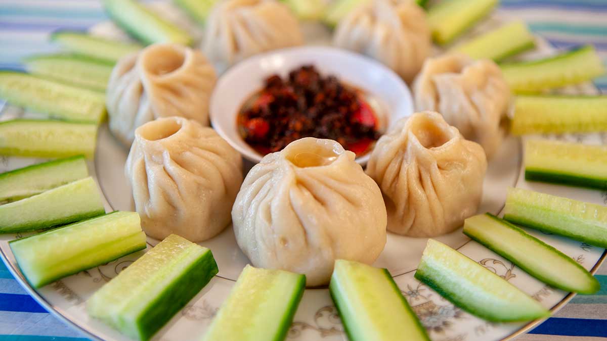 Plate of authentic Tibetan momos with spicy chutney