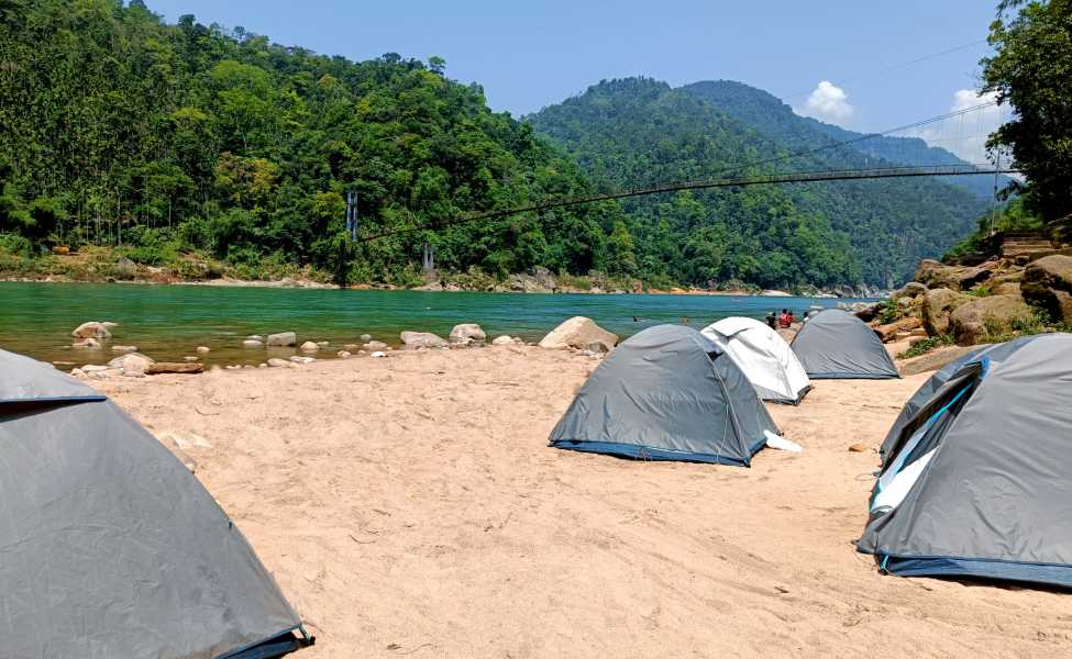 Tents set up by the Umngot River in Dawki