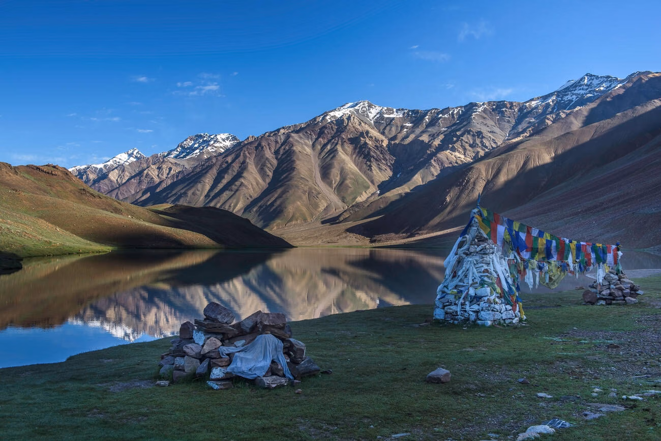 Camping tents in Komic village with monastery and mountains