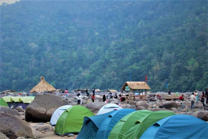 Camping in Meghalaya with misty hills and tents