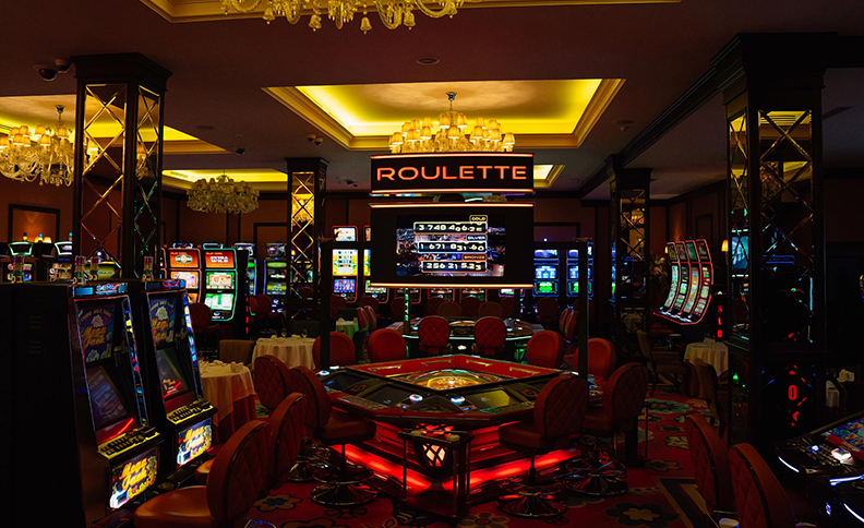 Gaming tables with roulette and card games in an Almaty casino