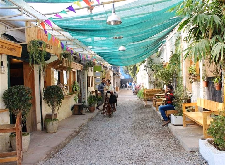 Champa Gali entrance with fairy lights and colorful decor