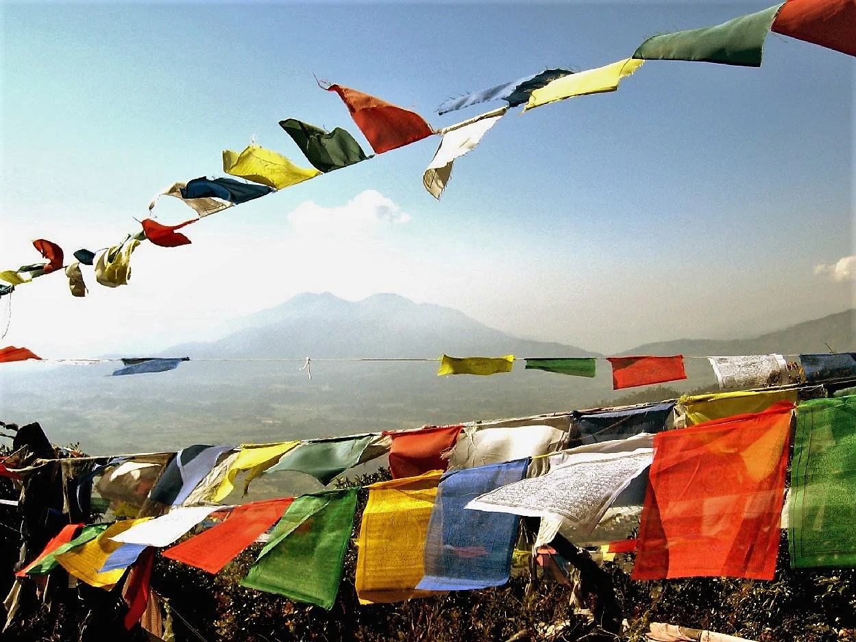 Colorful prayer flags at monastery entrance