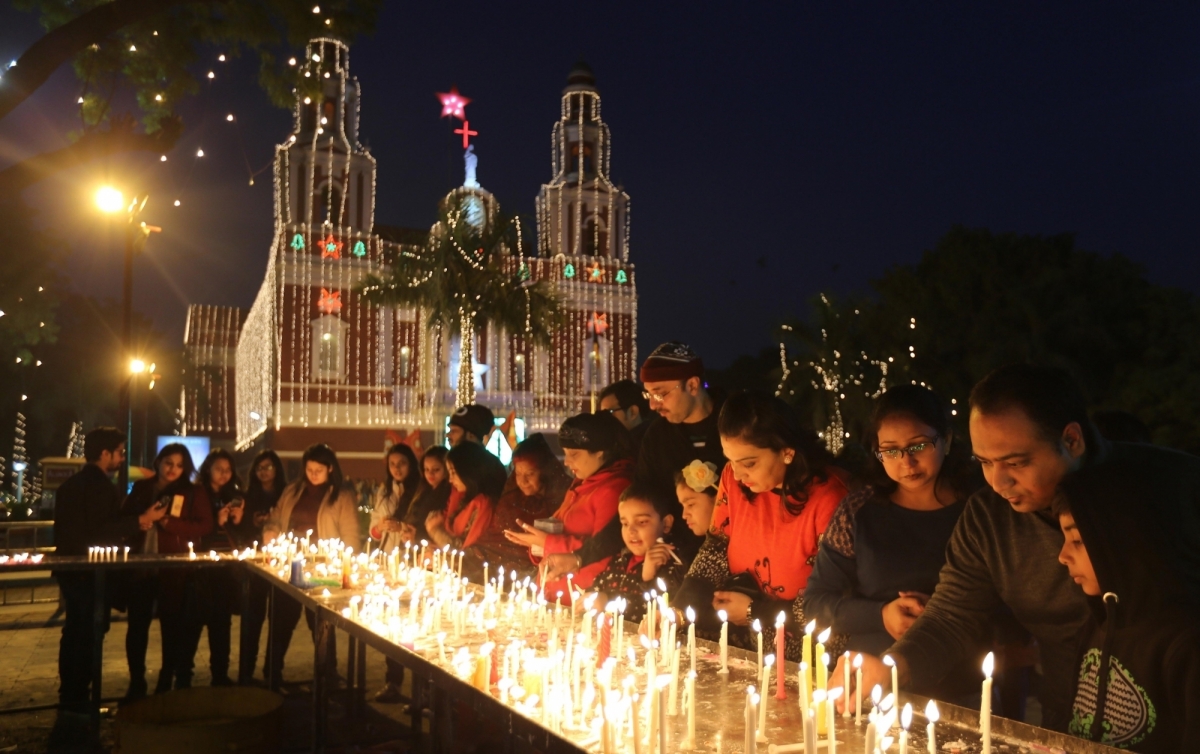 Midnight mass crowd at a decorated church in India during Christmas