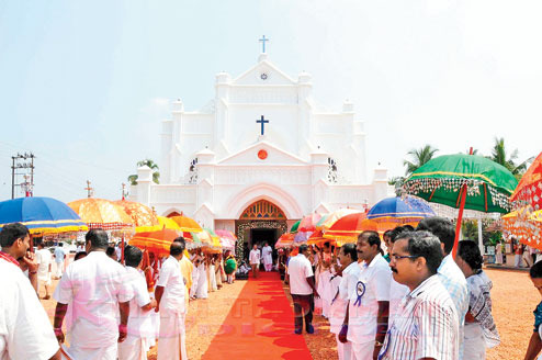 Visitors entering a church in Kerala respectfully