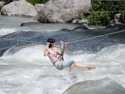 Zip lining across Kali River in Dandeli
