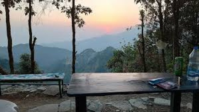 Sunset cafe atmosphere in Dharamshala with mountain backdrop