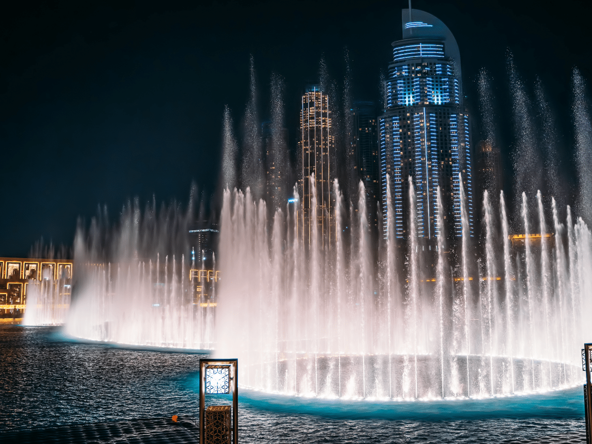Crowd watching Dubai Fountain show from waterfront promenade