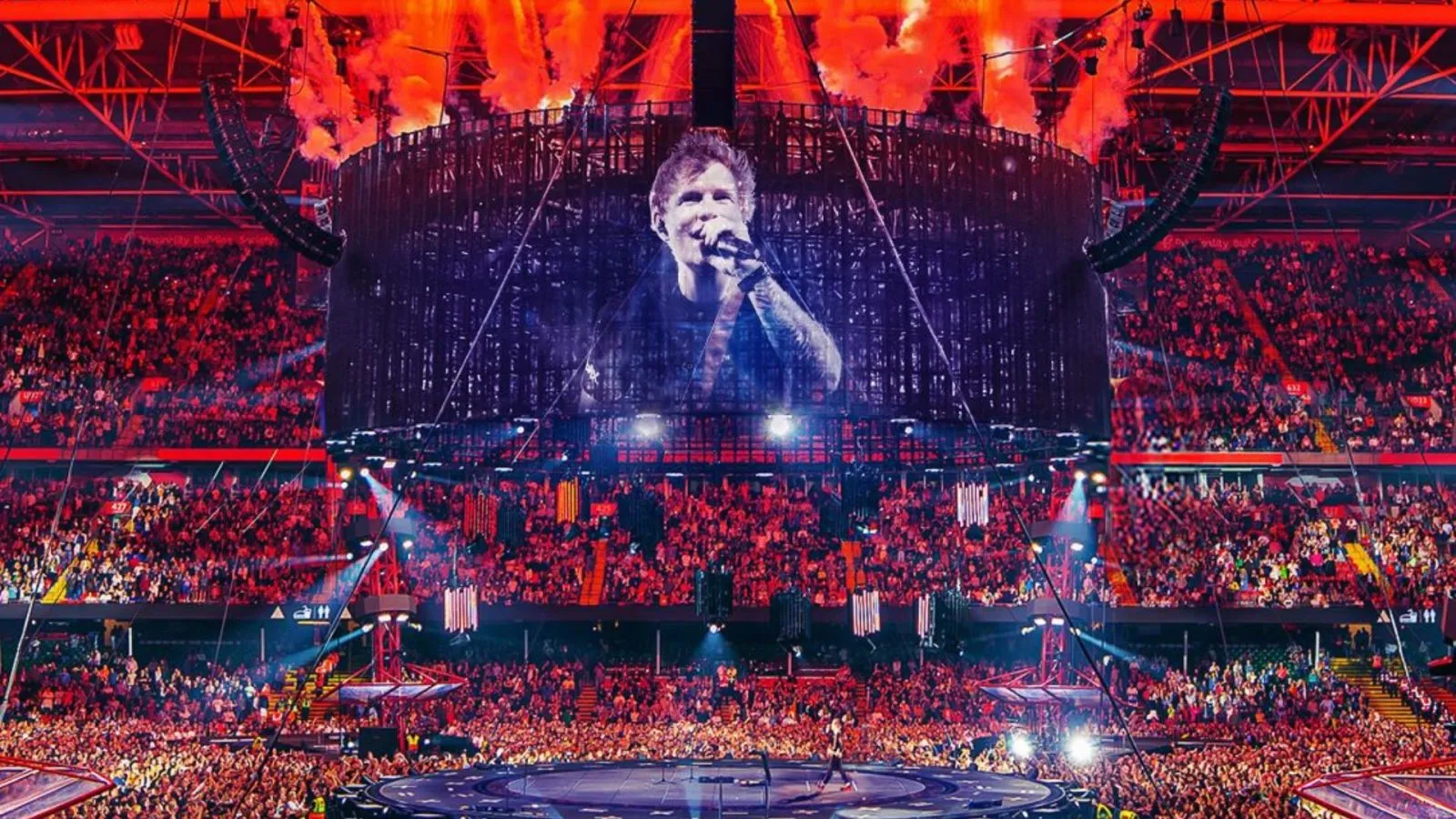 Concert venue entry lanes with security checks and crowd management barriers