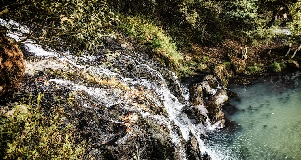 Viewing platform at Elephant Falls Meghalaya with waterfall cascading in background