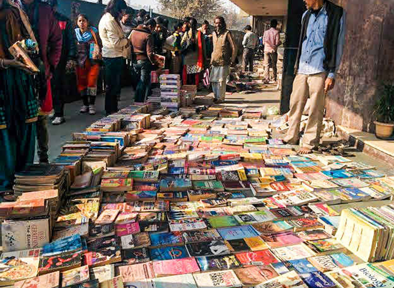 Book buyer checking condition at Fernandes Bridge