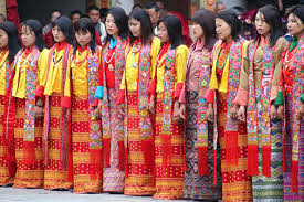 Bhutanese dancers in traditional colorful costumes performing at festival