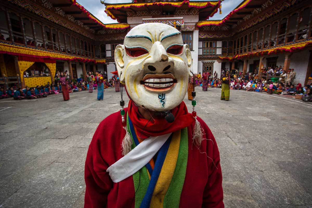 Bhutanese monks performing traditional Cham masked dances during Tsechu festival
