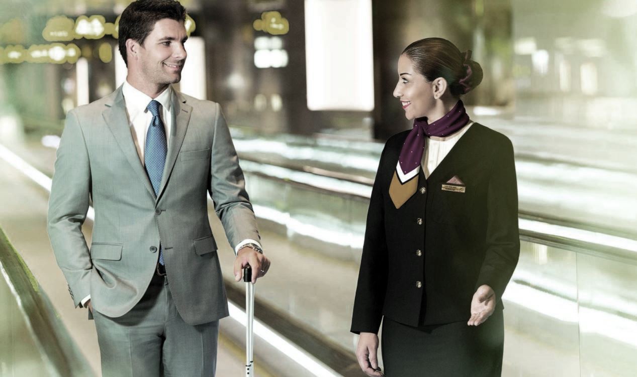 Passengers seeking rebooking support at airline counter