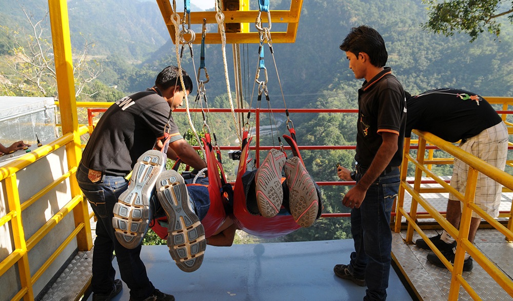 Safety gear and pre-launch check for Flying Fox in Rishikesh