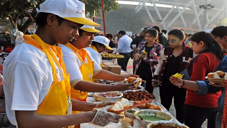 Indian regional food stalls serving different cuisines at a festival