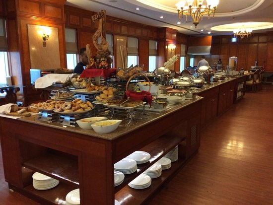 Traditional Emirati breakfast spread with chai and dishes