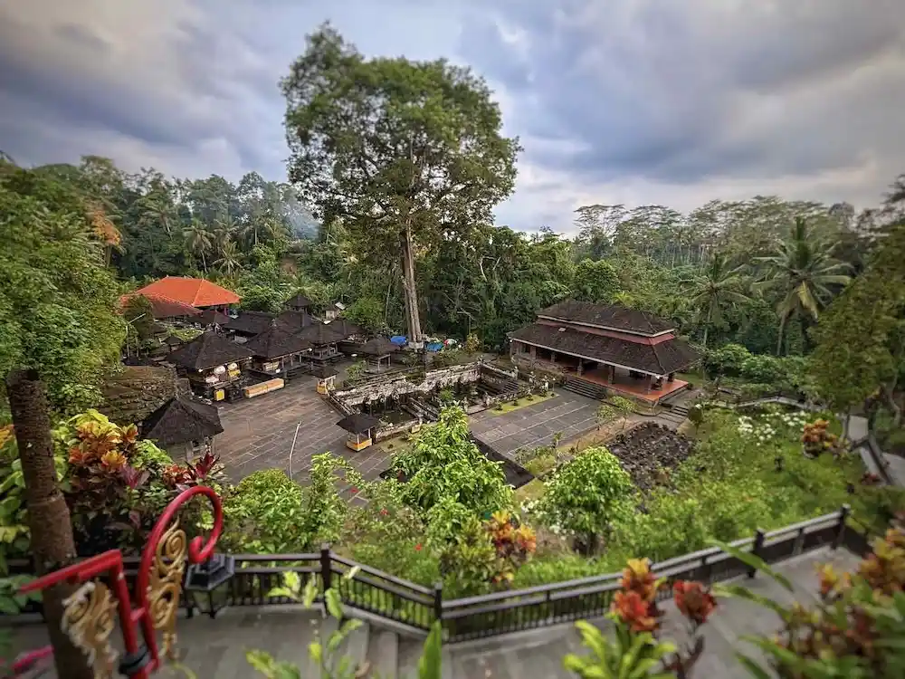 Temple garden pathways and stone carvings near Goa Gajah