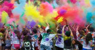 People celebrating Holi festival with colored powder