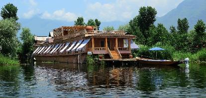 Traditional wooden houseboat exterior on Dal Lake in Srinagar