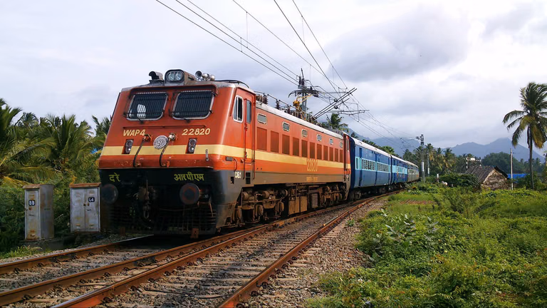 Train passing through scenic landscapes in Northeast India