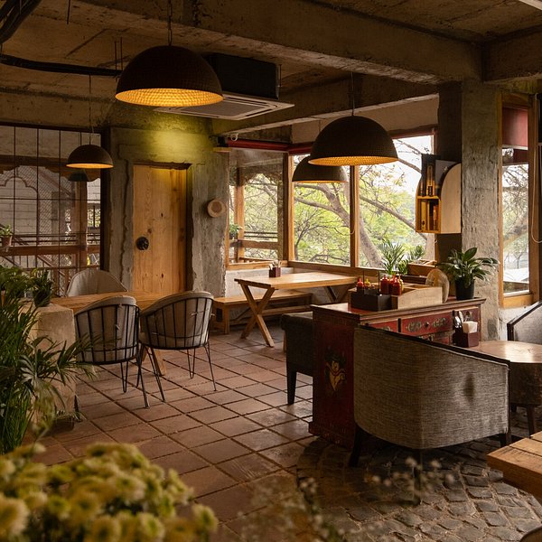 Aesthetic cafe interior in Delhi with warm lighting