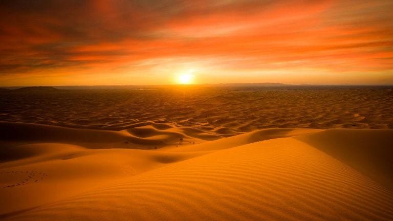 Sunset over golden sand dunes in Jaisalmer