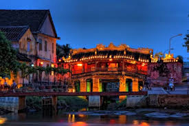 Japanese Covered Bridge illuminated at night with lanterns