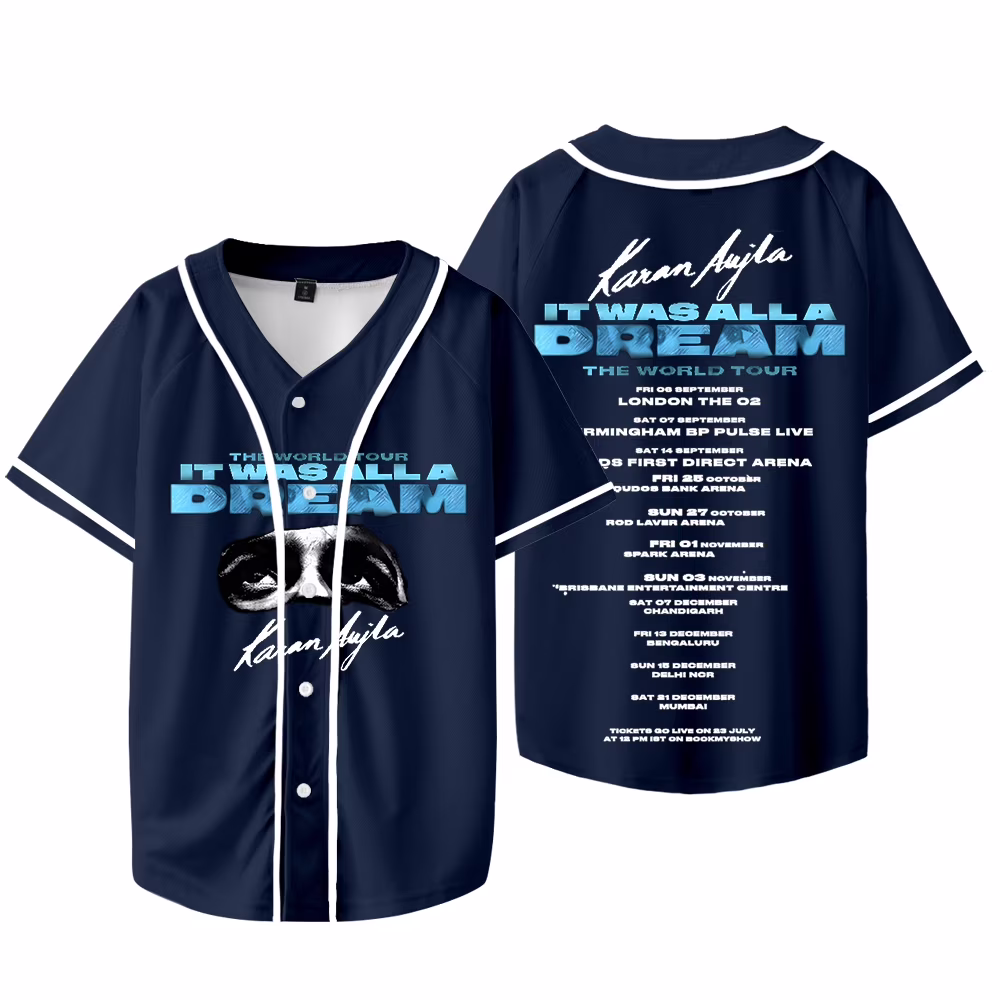 Concert merchandise stall displaying tour T-shirts, hoodies and accessories