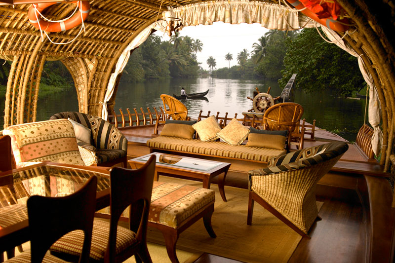 Interior of a traditional Kerala houseboat with modern amenities