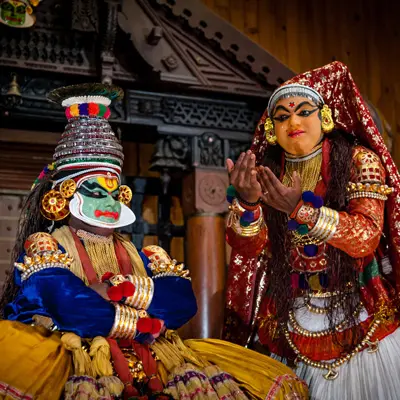 Kathakali performer in elaborate makeup and costume