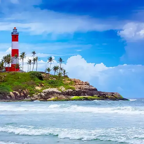 Lighthouse Beach Kovalam with iconic lighthouse and golden sands