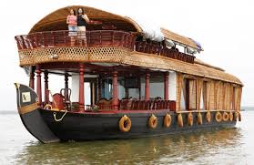 Beautiful houseboat cruising through Kumarakom backwaters