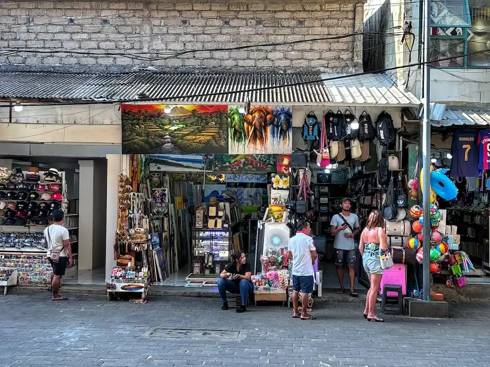 Inspecting goods at Kuta Art Market