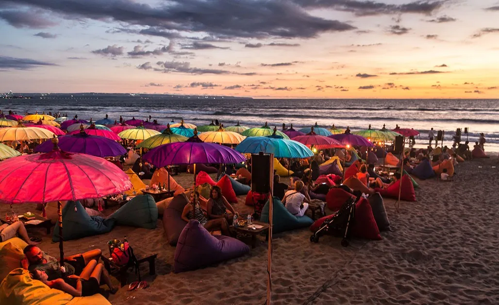 Beach bar sunset and nightlife transition in Kuta Bali