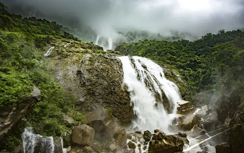 Rainbow forming at Kynrem Falls in sunlight