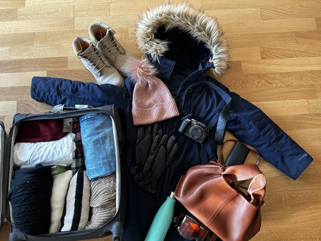Winter travel gear laid out for Ladakh cold conditions