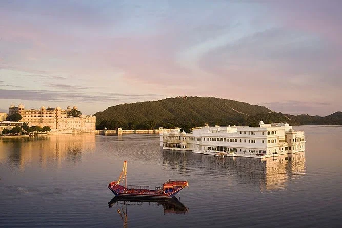 Lake Pichola Udaipur with city palace skyline and calm water reflections