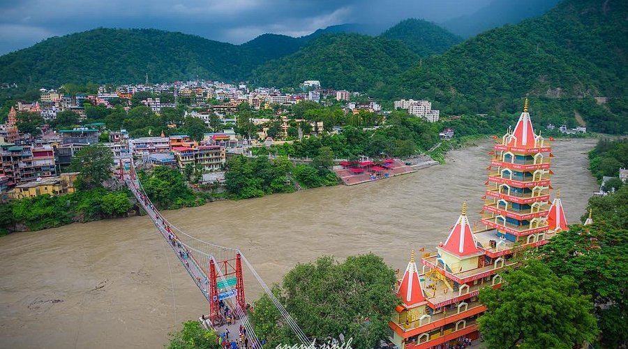 Lakshman Jhula bridge area with Ganga river and hillside views