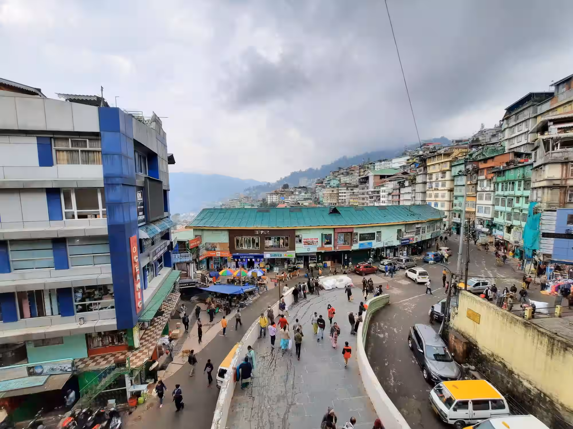 Narrow shopping lane with local vendors at Lal Bazaar Gangtok