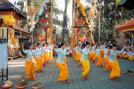 Balinese people in traditional dress communicating