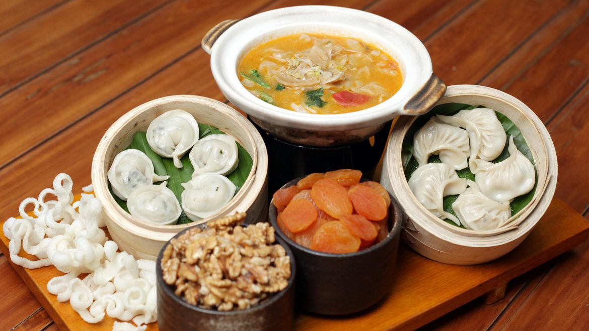 Traditional Ladakhi cuisine thali with Skyu and other dishes