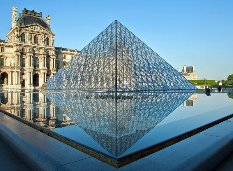 Morning view of Louvre Pyramid in Paris