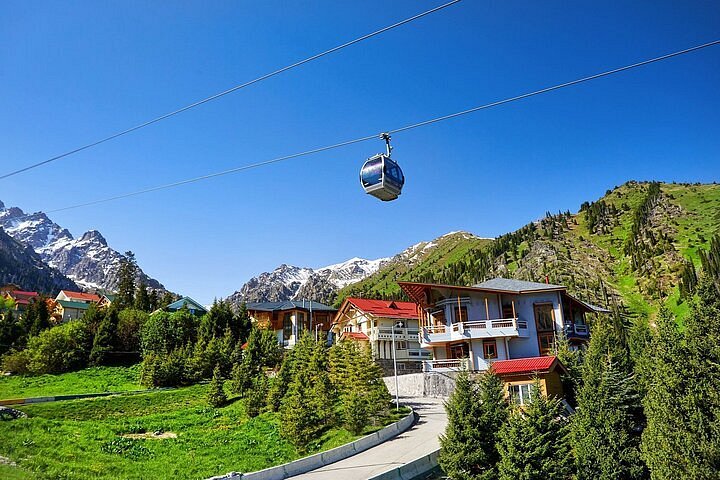 Cable car from Medeu to Shymbulak passing over mountain slopes with stunning views